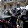 Activists of the Ukrainian far-right party National Corps clash with police outside the office of Ukrainian President Petro Poroshenko in Kiev on Saturday