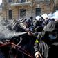 Activists of the Ukrainian far-right party National Corps clash with police outside the office of Ukrainian President Petro Poroshenko in Kiev on Saturday