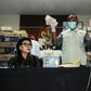 Corruption eradication commission officers in Jakarta show boxes of Indonesian currency totalling over 560,000 USD seized from a lawmaker's office ahead of elections