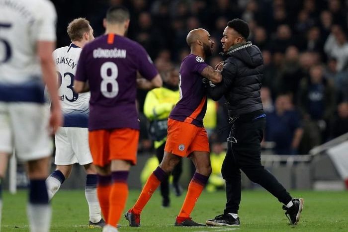 Man City defender Fabian Delph confronted the pitch invader