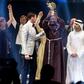 This picture provided on March 24, 2019 by the Global Education and Skills Forum of the Varkey Foundation, shows Kenyan teacher Peter Tabichi (C) in Dubai holding up the trophy for world's best teacher which comes with a prize of $1 million