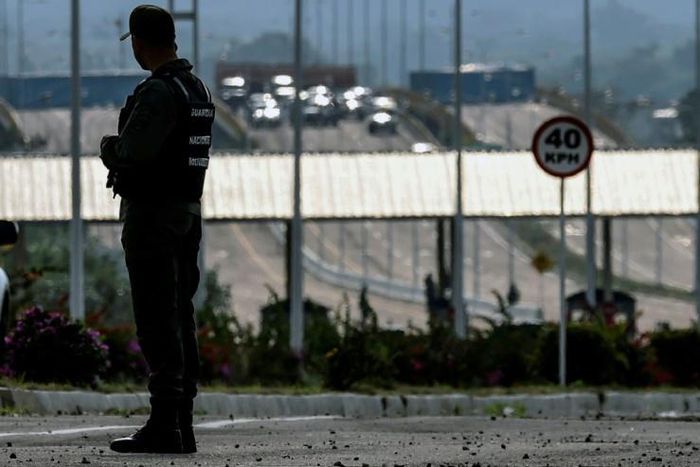 A member of Venezuela's Bolivarian National Guard patrols at the border with Colombia -- the country's opposition is trying to convince more military personnel to switch sides