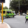 Ambulances rush towards one of the two mosques in Christchurch where a right-wing extremist armed with semi-automatic weapons rampaged during afternoon prayers
