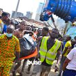 A corpse being taken away from the site of the collapsed building in Ita-Faaji, Lagos Island