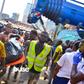 A corpse being taken away from the site of the collapsed building in Ita-Faaji, Lagos Island