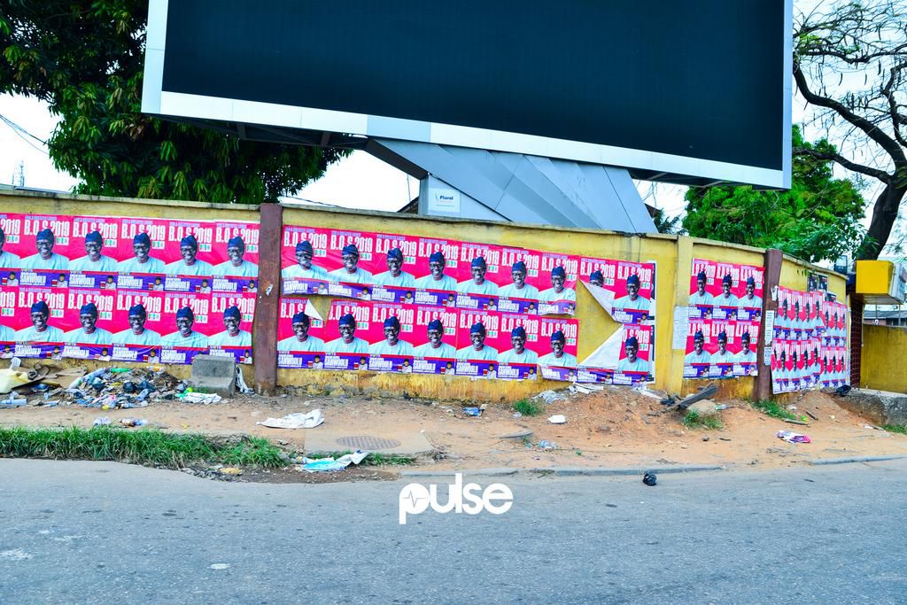 Posters of the governor-elect Babajide Sanwo-Olu on a wall at Allen Avenue roundabout, Ikeja (Pulse)