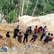 The rescue effort at the remote site on Indonesia's Sulawesi island has been hampered by steep terrain and unstable soil conditions