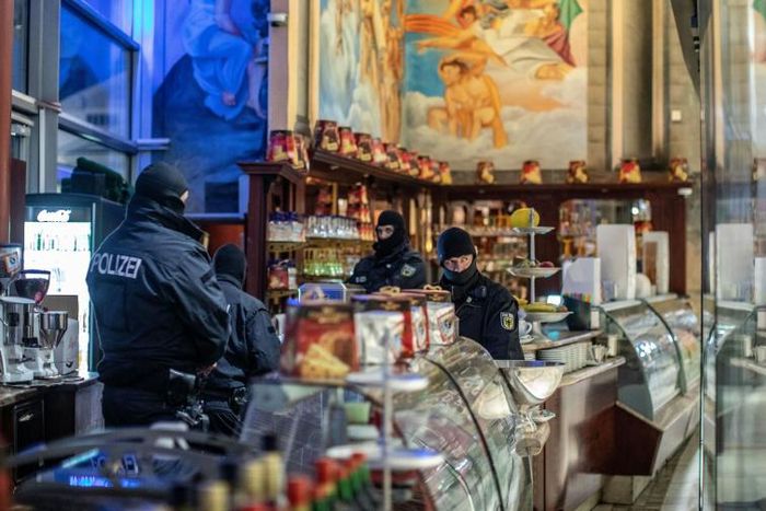 Ninety mobsters from the Calabrian 'Ndrangheta mafia were arrested in December in six different countries, in raids involving hundreds of police officers. Shown here is a raid in a cafe in Duisberg, Germany