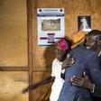 Ethnic Tutsi Jean-Bosco Gakwenzire (in the hat), 65, embraces Pascal Shyirahwamaboko, 68, who was among the killers of his father at Mutete, where the old schoolfriends have now reconciled