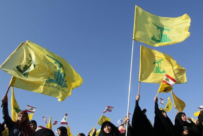 Hezbollah's flag features a Kalashnikov assault rifle