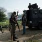 Police officers stand guard outside an election collection centre in Port Harcourt after Nigeria's presidental election