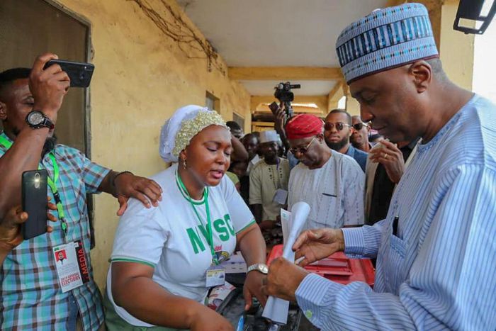 Saraki at his polling unit to cast his vote with his wife1