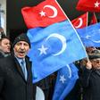 Demonstrators, seen here with Turkish flags and the flags of East Turkistan region used by Uyghur activists, have protested outside the Chinese embassy