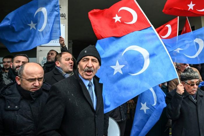Demonstrators, seen here with Turkish flags and the flags of East Turkistan region used by Uyghur activists, have protested outside the Chinese embassy