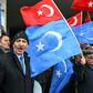 Demonstrators, seen here with Turkish flags and the flags of East Turkistan region used by Uyghur activists, have protested outside the Chinese embassy
