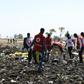 Red Cross teams work through the debris of an Ethiopian Airlines plane which crashed shortly after take-off from Addis Ababa, killing all 157 on board