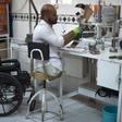 An Afghan orthopaedic technician makes artificial limbs in a workshop at the International Committee of the Red Cross hospital for war victims and the disabled in Kabul