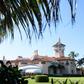 The woman was arrested at Mar-a-Lago after attempting to enter while carrying multiple mobile phones and a thumb drive containing malware, according to court documents