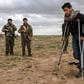 Men and boys suspected of being Islamic State fighters wait to be searched by members of the Kurdish-led Syrian Democratic Forces after leaving the IS group's last holdout of Baghouz on February 27, 2019