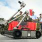 Canadian Prime Minister Justin Trudeau observes a military robot as he meets with Latvian, Canadian and other NATO soldiers in Adazi, Latvia, in July 2018