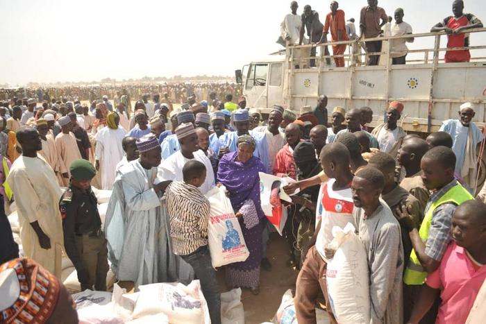 Some internally displaced persons receiving relief materials from an NGO/Illustrative [yenlive]