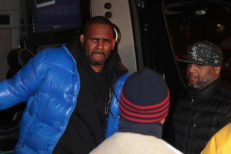 R&B singer R. Kelly is shown arriving at a Chicago police station on February 22, 2019, a day before a court set bail at $1 million on 10 charges of sexual abuse