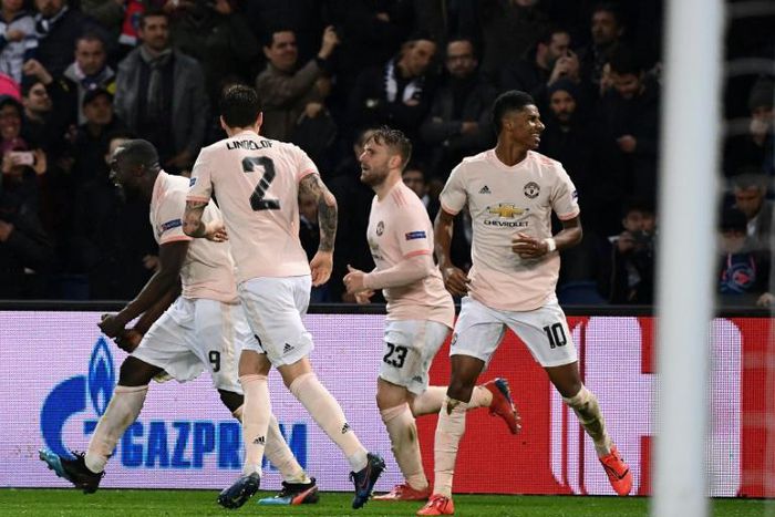 Marcus Rashford celebrates with his teammates after his last-gasp VAR-awarded penalty took Manchester United through at PSG's expense
