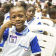 A pupil settles for the brush day and night pose at the Pepsodent 2019 World Oral Health Day celebration.