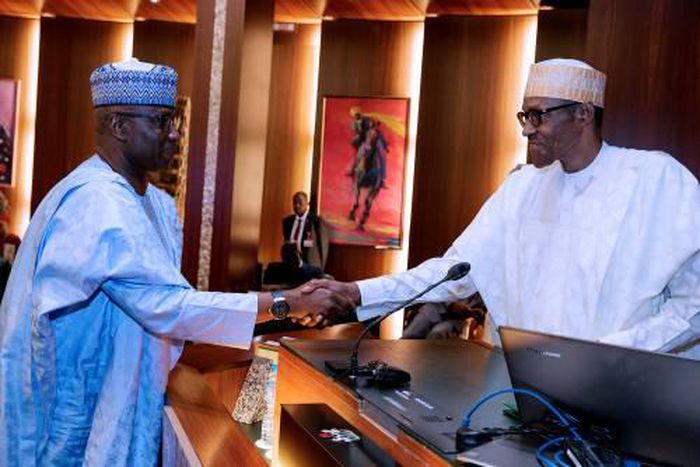 President Muhammadu Buhari shakes hands with Secretary to the Government of the Federation (SGF), Boss Mustapha