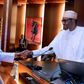 President Muhammadu Buhari shakes hands with Secretary to the Government of the Federation (SGF), Boss Mustapha