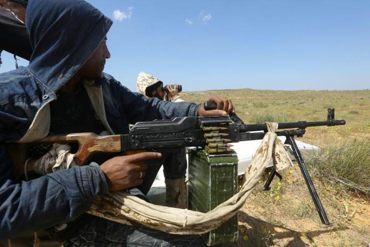 Fighters loyal to Libya's UN-backed unity government hold a position outside Tripoli as they fend off an offensive by strongman Khalifa Haftar