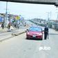 Nigerian police officers stop a car at a checkpoint in Mile 12 (Pulse)