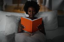 lady-reading-in-bed