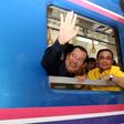 Cambodia's Prime Minister Hun Sen (left) and his Thai counterpart Prayut Chan-O-Cha aboard a train during a ceremony reconnecting a railway line between the two countries