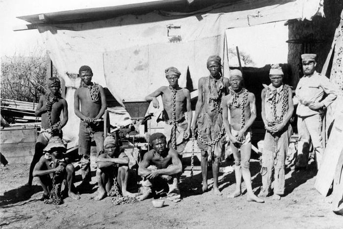 A colonial soldier (R) in German South West Africa (now Namibia) keeps a watchful eye over prisoners taken during the 1904-1908 war against the Herero and Nama people
