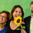 German Green party EU candidate Hannah Neumann (l) celebrates with party co-leader Annalena Baerbock and the Greens top candidate Sven Giegold after the exit poll figures were announced