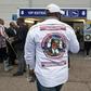 A stranded traveler, wearing a portrait of Etienne Tshisekedi on his shirt, stands outside the airport in Melsbroek after the flight for the repatriation of the remains of the late Congolese opposition leader was cancelled