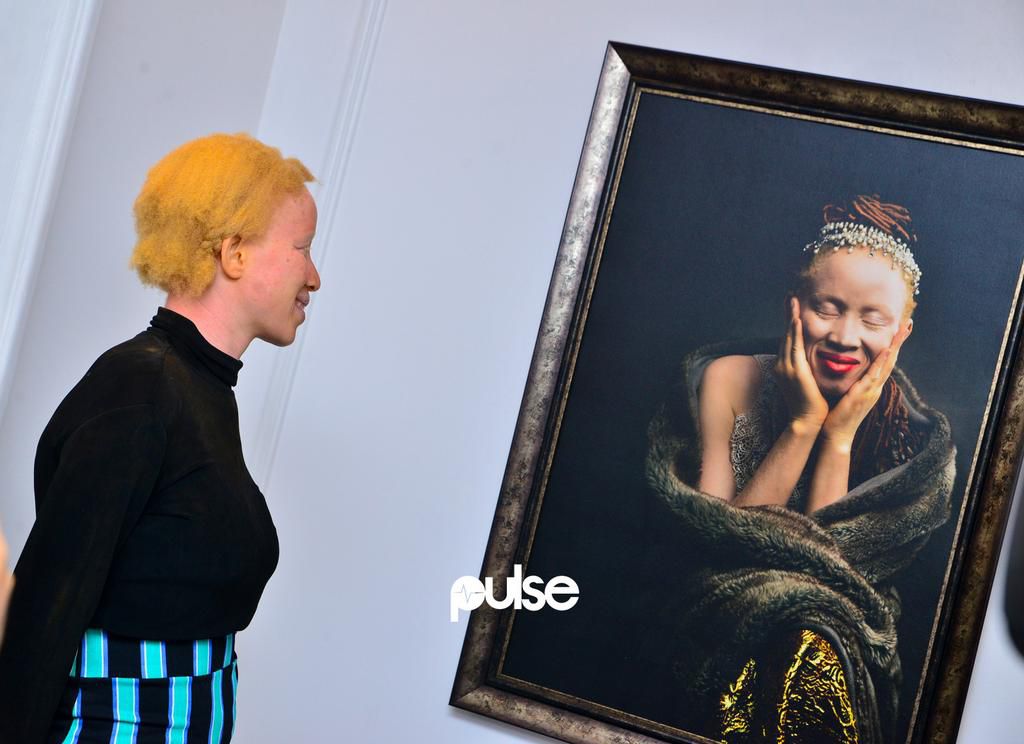 One of the models looking at her portrait at the SMO White|Ebony exhibition opening which held on Saturday, May 25, 2019 at Temple Muse, Victoria Island Lagos.