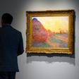 A Claude Monet painting from his celebrated "Meules" (Haystacks) series drew $110.7 million at Sotheby's in New York in an auction record for the French Impressionist master