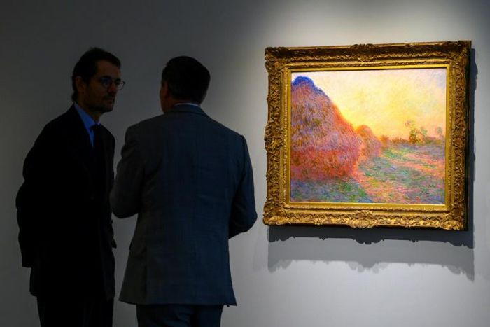 A Claude Monet painting from his celebrated "Meules" (Haystacks) series drew $110.7 million at Sotheby's in New York in an auction record for the French Impressionist master