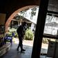 A police officer stands guard beside a window full of bullet holes at an Ebola treatment centre in Butembo. Suspected Mai-Mai tribal militia raided the ETC and killed a policeman and wounded a health worker early in March
