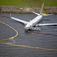 The plane skidded off the runway while landing at the naval air station during a thunderstorm