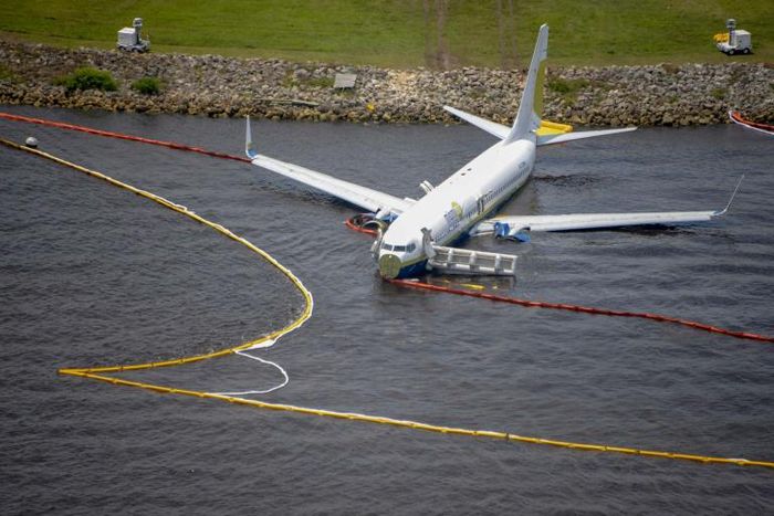 The plane skidded off the runway while landing at the naval air station during a thunderstorm