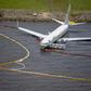 The plane skidded off the runway while landing at the naval air station during a thunderstorm