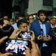 Venezuelan Deputy Carlos Prosperi (C) talks to the press outside the Democratic Action Party's headquarters after the arrest of Edgar Zambrano, deputy leader of the opposition-dominated National Assembly