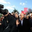 The chairman of the Republican People's Party (CHP) Kemal Kilicdaroglu (C) was assaulted by a mob at a soldier's funeral on Sunday