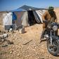 A Nomadic herder rides his motorcycle near tents in the southern Moroccan Tiznit province in the region of Souss-MassaDrought has turned parts of the plateaus of Tiznit arid, and when water becomes scarce, tensions rise