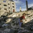 A Palestinian girl climbs on the remains of a building destroyed during an Israeli air strike on Rafah in the southern Gaza Strip on May 5, 2019