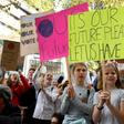 Students hold up placards during an environmental protest in Melbourne on May 3, 2019