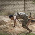 Libyan fighters loyal to the internationally recognised Government of National Accord (GNA) run for cover during clashes forces of strongman Khalifa Haftar south of the capital Tripoli